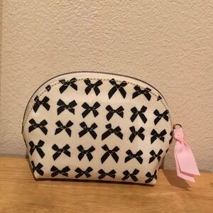 Charming Bow-Patterned White and Black Pouch. Brand new with tags, never used.